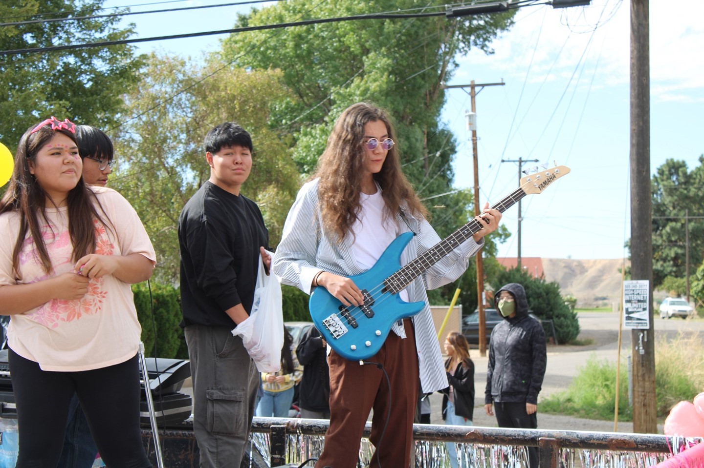 Class float at homecoming-senior student playing guitar