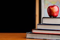 Books and an apple